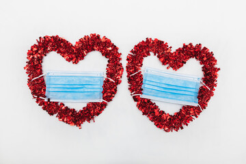 Two hearts with mask on a white background