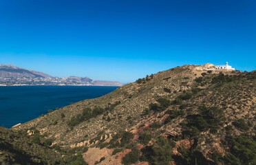 Natural park 'Serry Gelada' with view to lighthouse and ruin of ocher mine along the coast of...