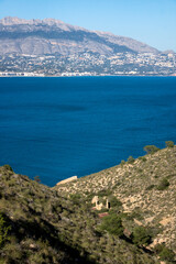 Natural park 'Serry Gelada' with view to Altea and ruin of ocher mine along the coast of Albir, Spain