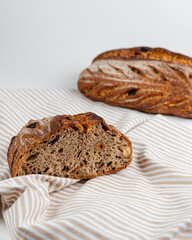 Fresh loaves of bread on a white table