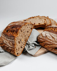 Fresh loaves of bread on a white table