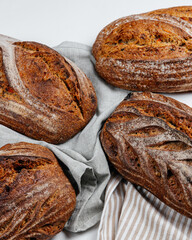 Fresh loaves of bread on a white table