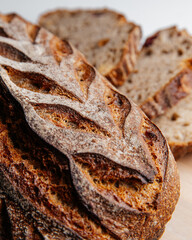 Fresh loaves of bread on a white table