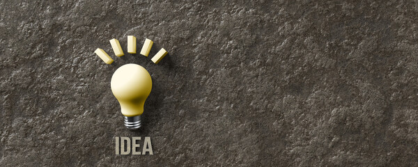 message IDEA and a lightbulb symbol on stone background