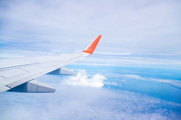 Fototapeta na wymiar Airplane wing On the blue sky