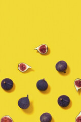 Colorful fresh figs fruit pattern on bright yellow background, whole and sliced fig.