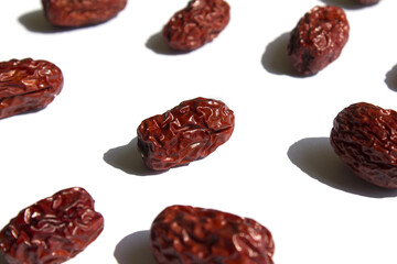 close up Red dates on white background.