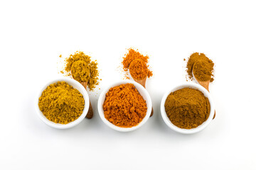 Herbs, cinnamon sticks and spice powder on white background.