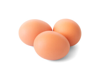Three fresh brown eggs isolated on white background. With clipping path. Closeup and macro.