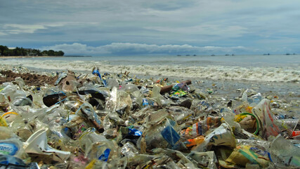 Fototapeta na wymiar 4K video of plastic garbage and other trash on sea beach. Ecological concept