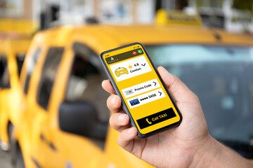 man hands holds phone with taxi call application on screen