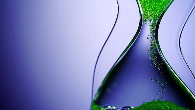 Liquid type of hourglass as time passing concept for business deadline, urgency and running out of time.