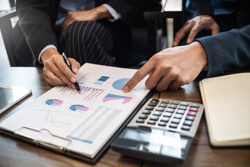 Financial inspector calculating a numbers in office room..