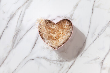 Empty beautiful gift boxes in the form of hearts for Valentine's Day, Birthday and Mother's Day. Marble background.