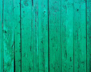 Fototapeta na wymiar Green boards on the fence as an abstract