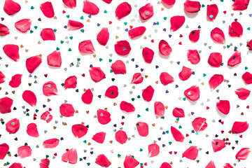 Rose petals and heart-shaped confetti are on a white background.  Floral layout for valentine's day, birthday, wedding invitation. Flat lay. Top view.