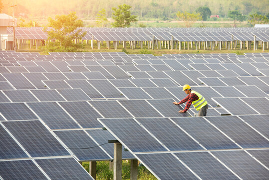solar power station,Solar panels with technician,Future electrical production, asian engineers