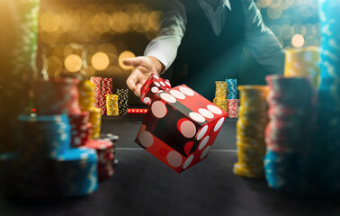 Man gambling at the craps table at the casino - 404425428