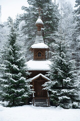 The temple in the winter forest. Christmas. Winter, forest, nature, tourism, snow, fir trees.