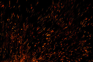 flame of fire with sparks on a black background