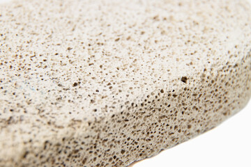 Bathroom spa foot scrubber for removing dead skin isolated on a white background closeup shot