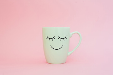 Happy friday word. Cup of coffee on pink background with smile face on mug. Concept about love and...