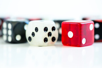 Selection of multi coloured dice on white background