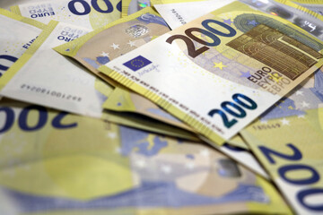 Euro bills of 200 are on the table.