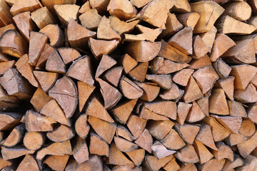 Stacked firewood for kindling the stove. Background.