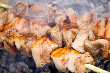 Georgian traditional dish, Mtsvadi on the fire, raw meal on the grill