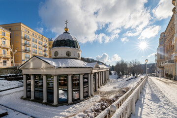 Pavilion of mineral water spring in winter under snow - Cross spring (in Czech Krizovy pramen) -...