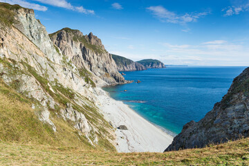 Fototapeta na wymiar Russia. Far East. Seaside region. Sea of Japan. The area of the village named Olga. Beautiful view of the Sea of Japan from the side of the cape named four cliffs.