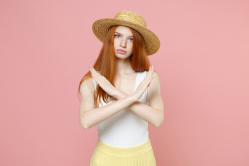 Young serious strict refusing caucasian redhead woman ginger long hair wear straw hat summer...