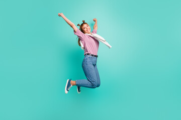 Fototapeta na wymiar Full size photo of young happy excited cheerful positive good mood girl jump in victory isolated on teal color background