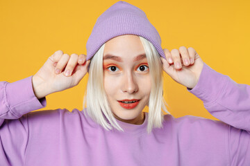 Close up photo young blonde caucasian woman 20s bob haircut bright makeup in basic purple shirt put...