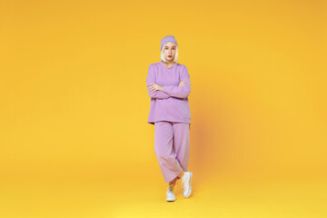 Full length of young blonde caucasian woman 20s with bob haircut wearing casual basic purple suit...