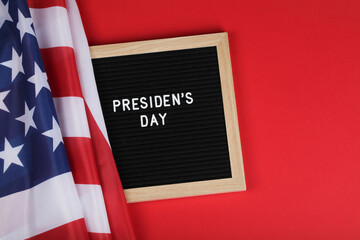 black letter board with text president day and American flag on red background. top view flat lay copy space 