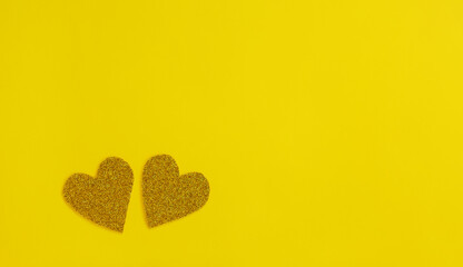 Bright yellow background with glitter yellow hearts. Illuminating Yellow color of 2021