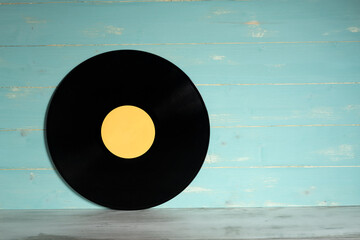 Vinyl record on wooden background,Old vintage vinyl record isolated