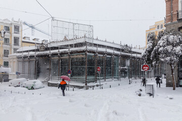 san miguel market in madrid theater covered by snow from the storm philomena