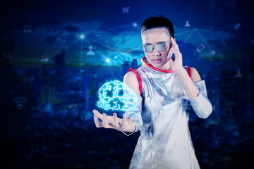 Woman using futuristic glasses for look at a brain