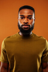 young pretty african american man posing cheerful on brown background, lifestyle people concept