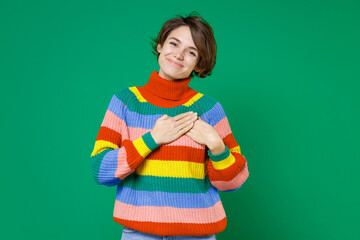 Smiling pretty young brunette woman 20s years old wearing basic casual colorful sweater standing...