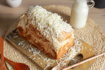 Close up of delicious whole wheat bread with grated cheese on top
