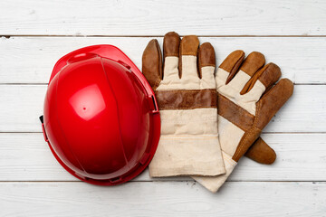 Hardhat and gloves of construction worker top view