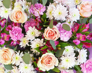 Top view on beautiful fresh flowers of pink shades: carnations, chrysanthemums and roses. Floral texture for background. Romantic congratulation for Valentine's Day, March 8, wedding or Birthday