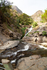 Fototapeta na wymiar Ravana Waterfall in a rutting mountain gorge in Sri Lanka.