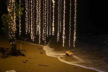 vivid light with tree in the shore at night