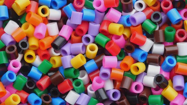 Colorful fusible plastic beads. Close up.