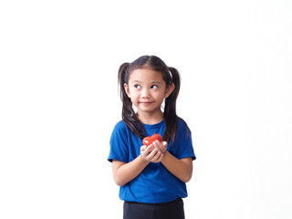 Little girl holding red heart